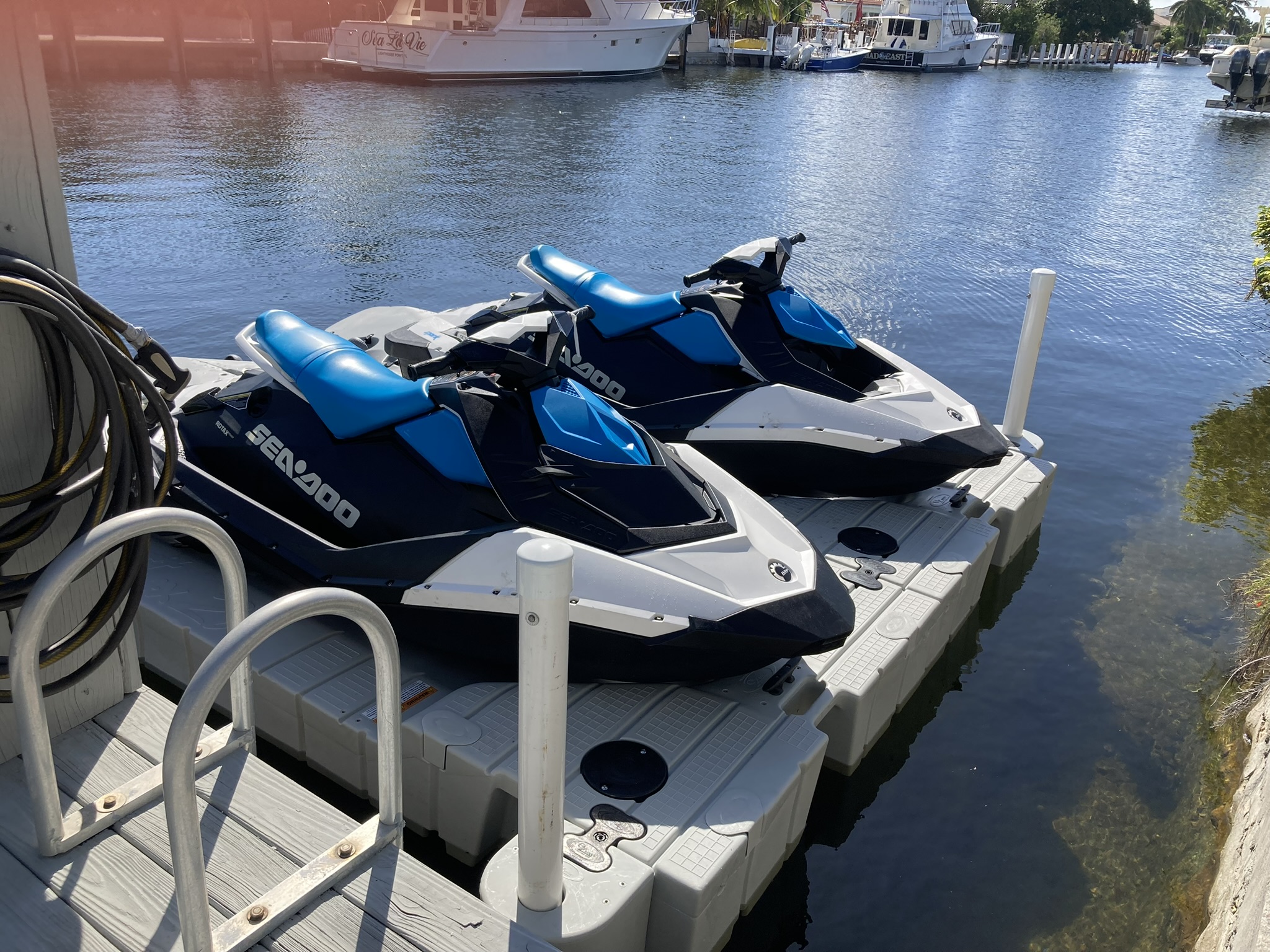 Two Sea-Doo Spark skis on a floating dock